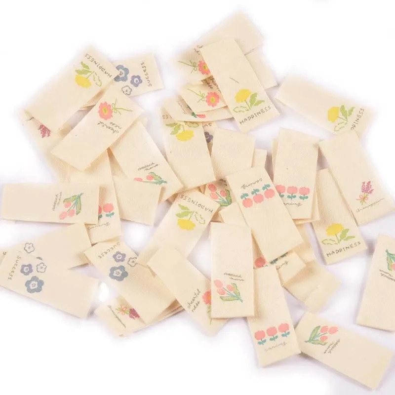 50Pcs/Lot 1.6x3.8cm Flower Beige Labels For Sewing Supplies Care Bags Clothes Tag Garment Handmade Accessories DIY Crafts C2887