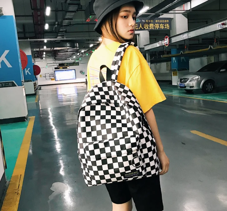 Black and white plaid student backpack fashion trend backpack large capacity lightweight breathable wear-resistant schoolbag