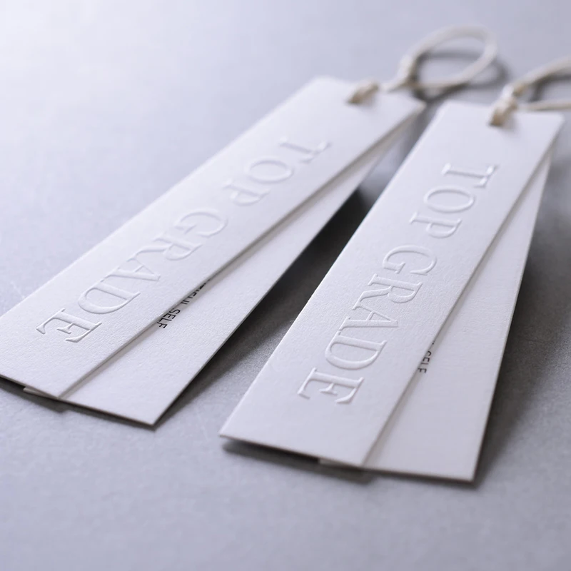 High Quality Customizing White Cardboard with Embossing Text Elegant Simplicity Design for Clothing Tag Brand Label Garment Shop