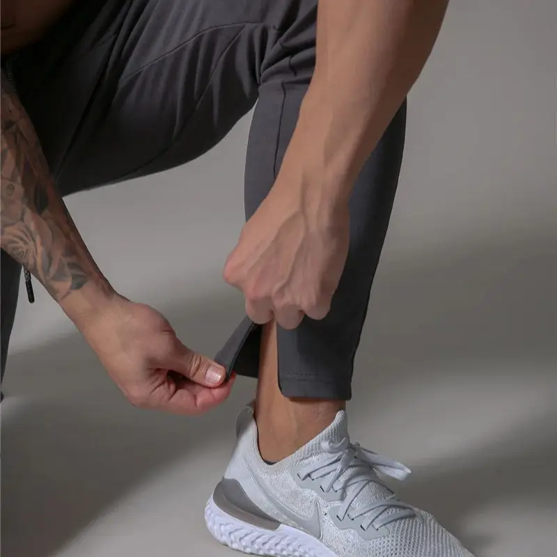 2021 nowe spodnie do joggingu mężczyźni Fitness Joggers spodnie do biegania mężczyźni Sport treningowy legginsy odzież sportowa spodnie dresowe