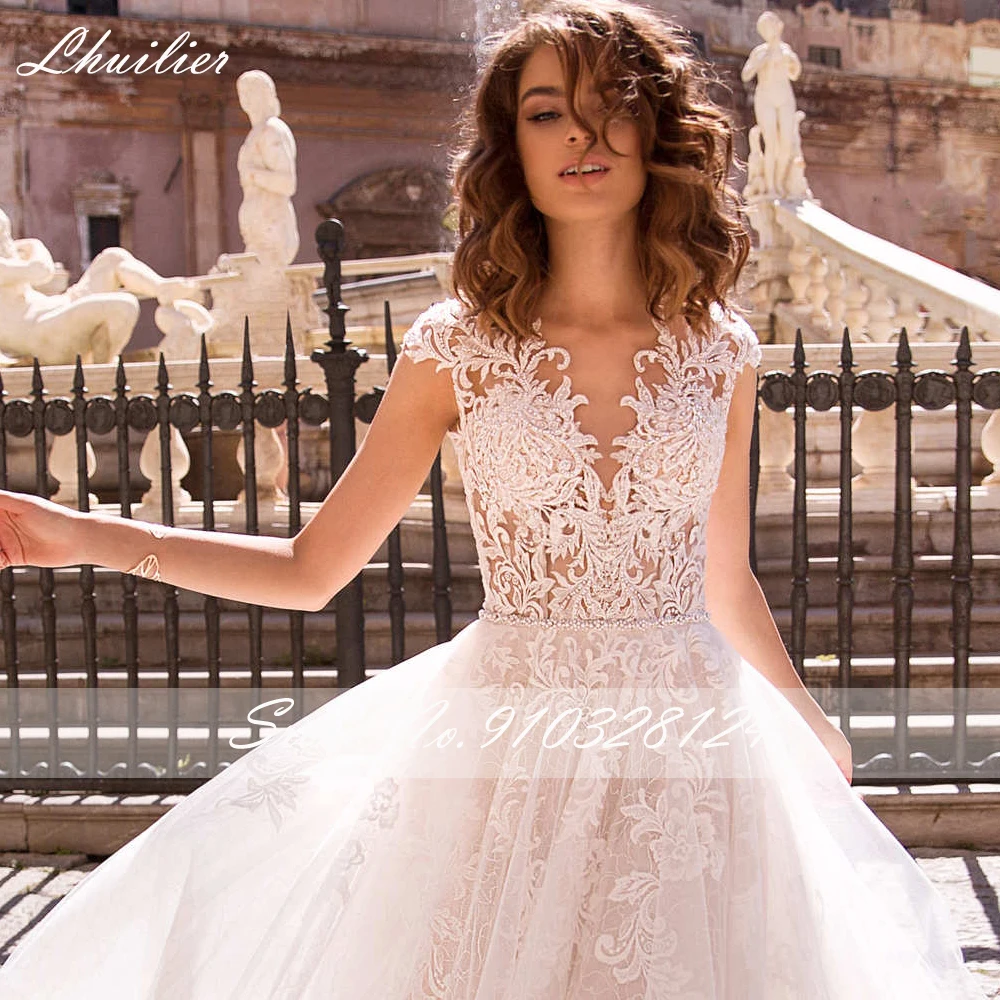 Lhuilier A-line V-neck Illusion Wedding Dresses Crystal Beaded Sleeveless Floor Length Lace Appliques Bridal Dress with Belt