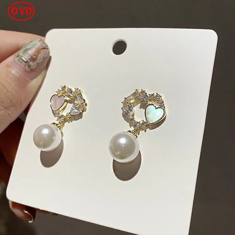 

2021 new natural pearl 925 silver needle Korean high-end rhinestone net red tide temperament earrings