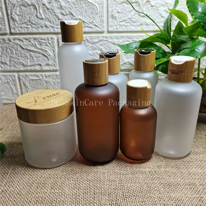 

frosted matte plastic toner lotion bottles and body butter cream with bamboo cap lid lotion bottles with disc top cap