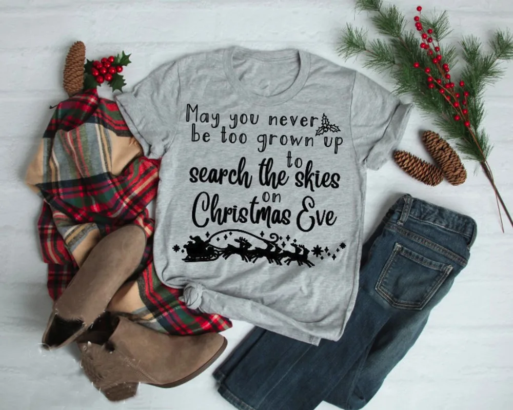 Christmas Slogan Fashion Unisex Goth Tshirt May You Never Be Too Grown Up To Search The Skies on  Eve Graphic Tee Shirt