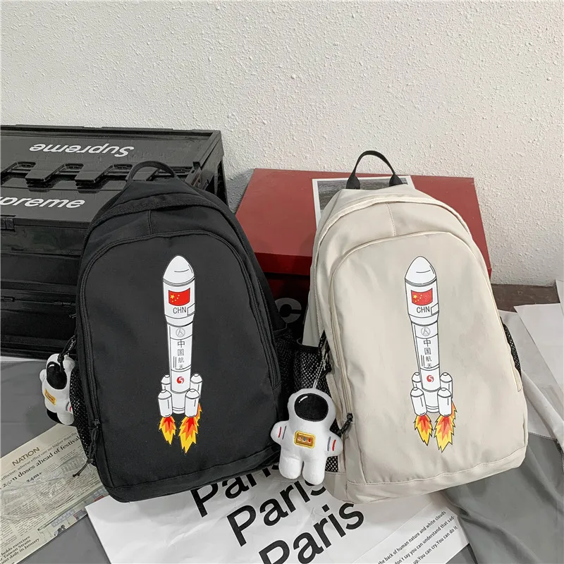 Kawaii Cute Cartoon Rocket Pattern Backpack Unisex and Large Capacity Student Couple Schoolbag To Send Doll Pendant