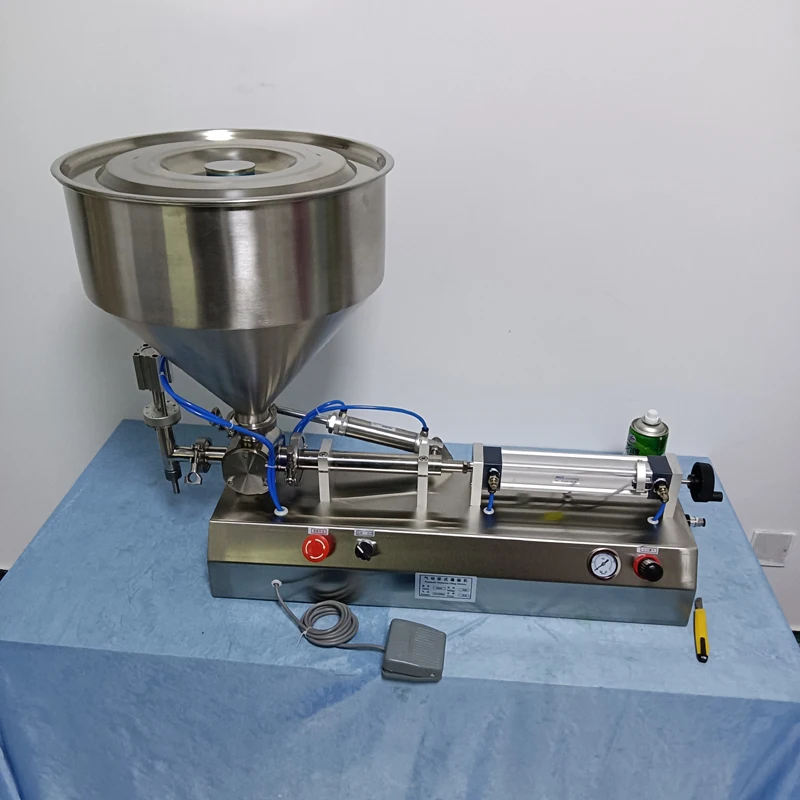 Pequeña máquina neumática de llenado de pasta de un solo cabezal, máquina de llenado eléctrica de productos para el cuidado de la piel, salsa de pasta de propóleo