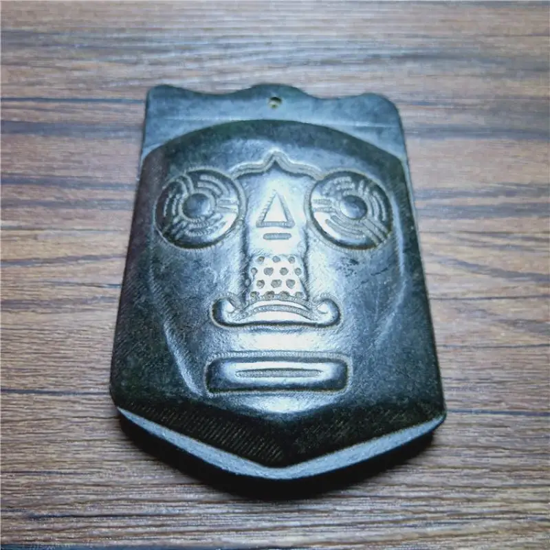 

Chinese Tibet Hongshan Culture Natural Meteorite Mask Carved Mascot Statue and Sculpture Collection Pendant Accessories Gift