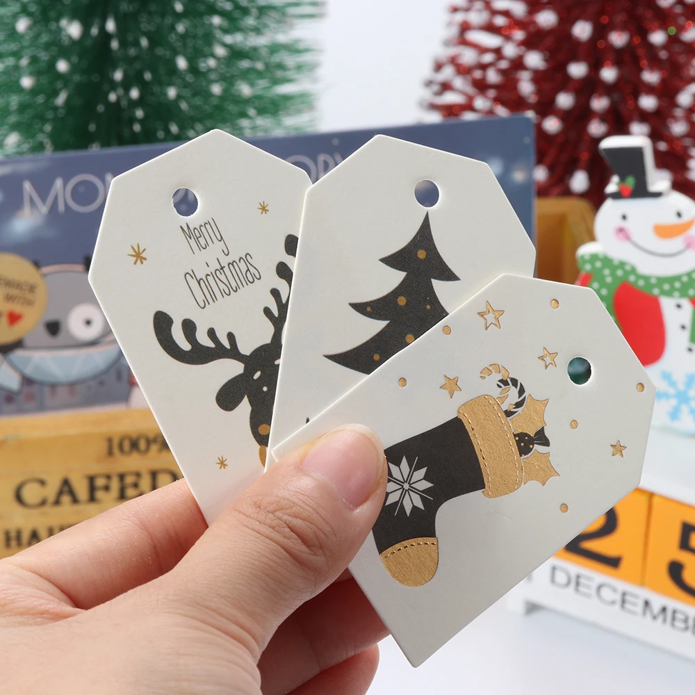 50/100PCS Boże Narodzenie zawiesić papierowe etykiety Wesołych Świąt kartka z papieru pakowego etykiety DIY Scrapbooking rękodzieło prezent ślubny