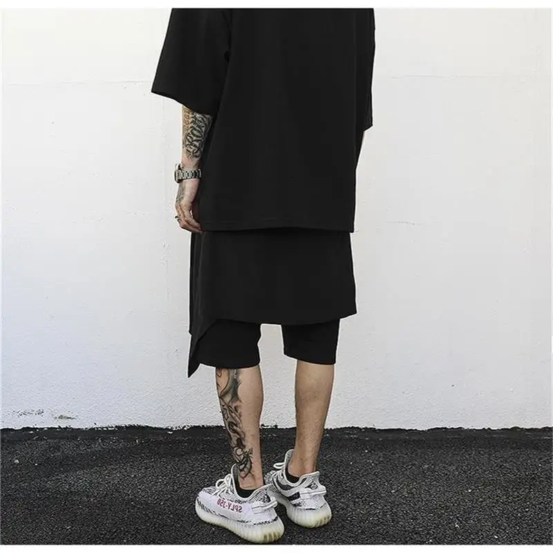 Men's hip-hop style personality trend asymmetry spliced tight waist five minute pants high street style harem pants