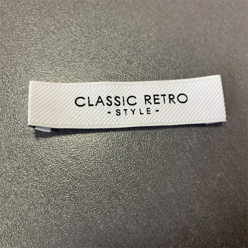 

Customzied 1.5*6cm High Density High Soft Washable Woven Fabric Labels For Clothing