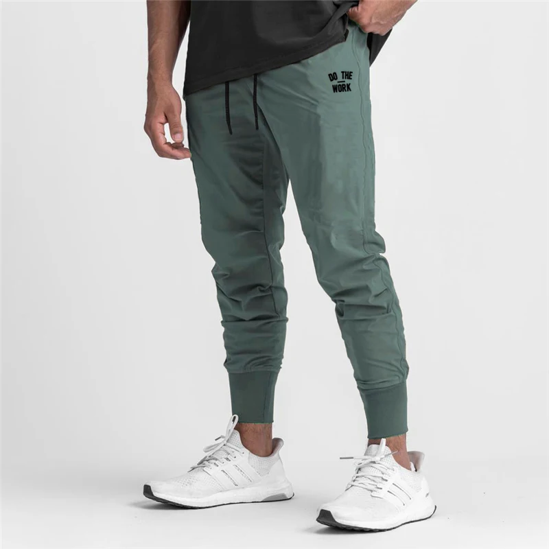 Joggers pantalones casuales de los hombres pantalones ajustados haz boca Pantalones Hombre Pantalones de gimnasio de entrenamiento de Fitness culturismo Pantalón deportivo