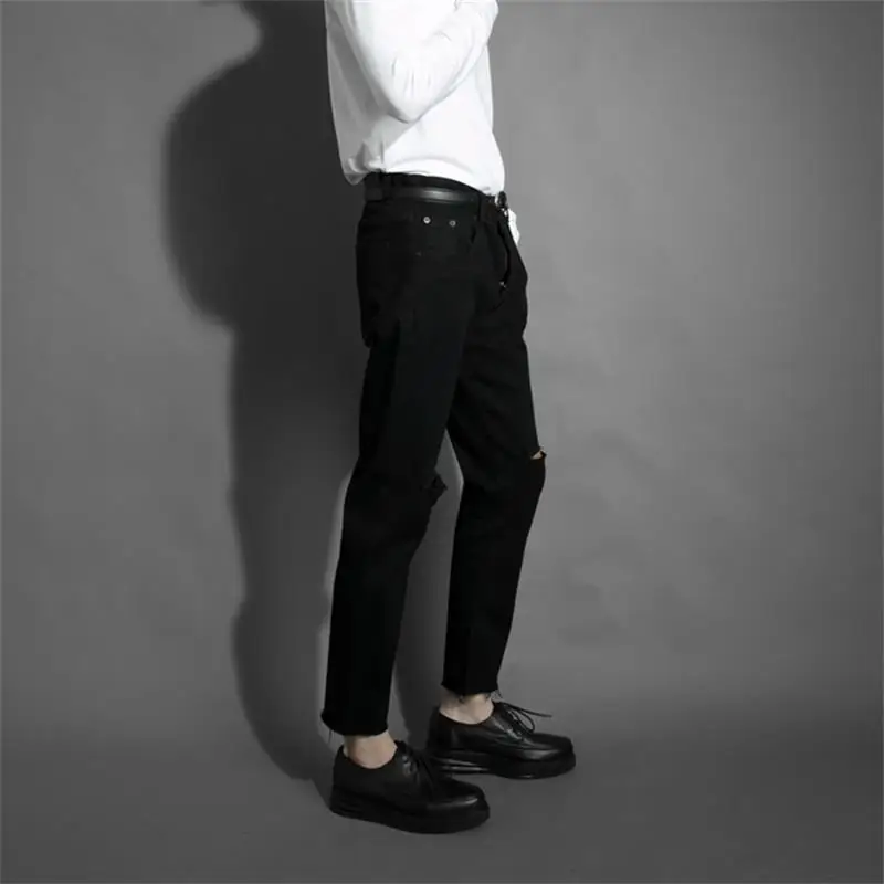 Men's spring and autumn new dark black Korean version slim broken hole beggar pants wool edge jeans nine casual jeans