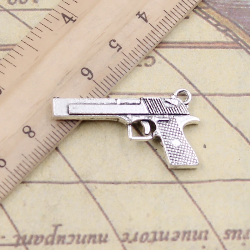 10 sztuk Charms pistolet brązujący pistolet 45x20mm tybetański brąz srebrny kolor wisiorki antyczny tworzenia biżuterii DIY Handmade Craft wisiorek
