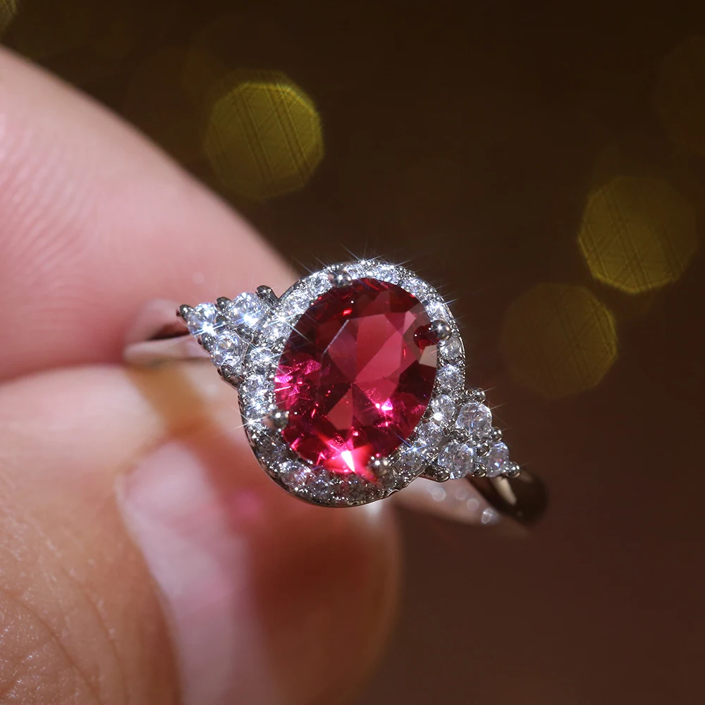 Huitan schillernde Zirkonia Frauen Ringe romantische ovale rote Stein engagieren Ehering Valentinstag Geschenk für Liebhaber Modeschmuck