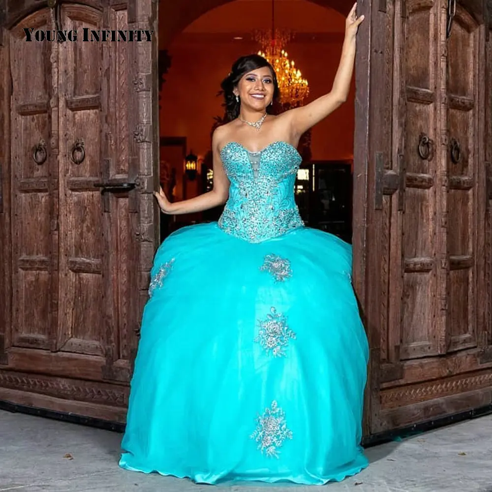 Charming Blau Bodenlangen Quinceanera Kleider Tüll Schatz Backless Perlen Appliques Pailletten Kapelle Zug Ballkleid 2021