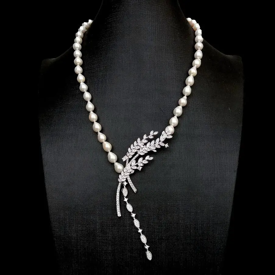 

YYGEM 8x10mm Natural Freshwater Cultured White reborn keshi Pearl Necklace Cz Pave ear of rice shape silver plated connector 19"