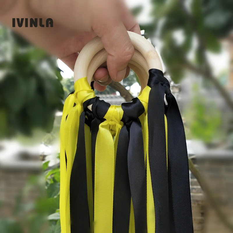 Free Shipping yellow and black Stain ribbon Wooden Ring Waldorf Ribbon With Bell Hand Kite Toy FLY ME Birthday Party Favors