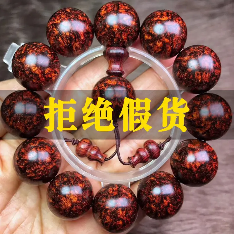 

Dalbergia odorifera authentic Hainan Huanghua pear hand string ghost face to eye Sea Yellow Buddha bead male tumor scar Wenwan