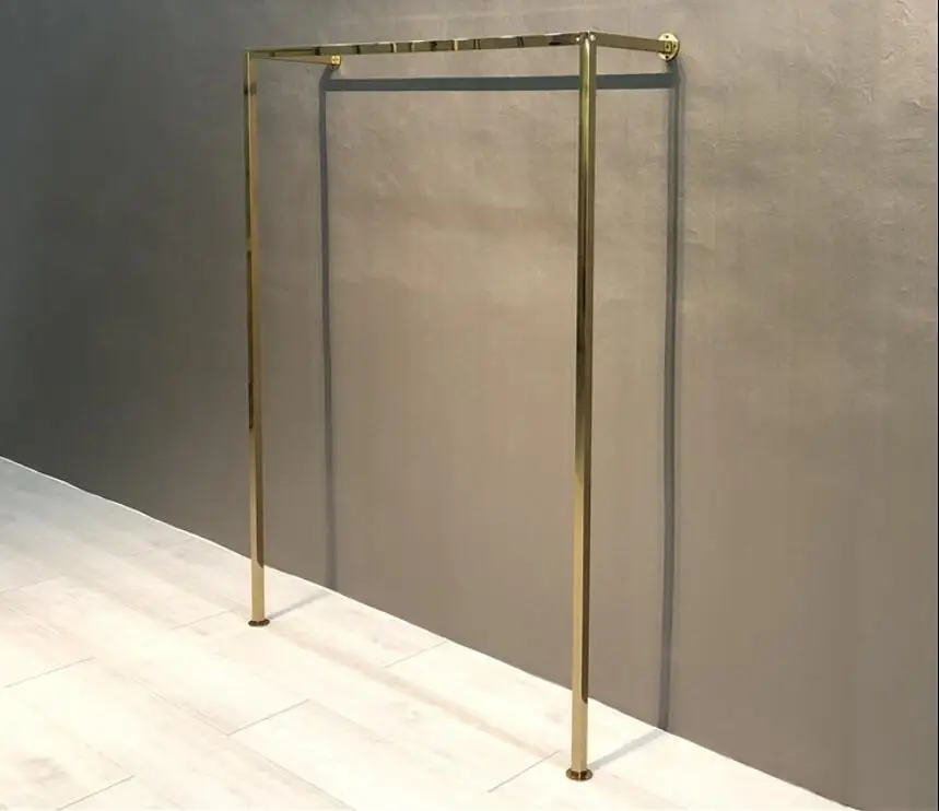 Titanium gold stainless steel display stand on the wall of clothing store