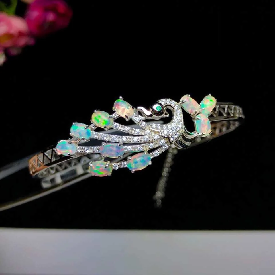 

Natural opal bracelet, Phoenix style. Auspicious symbols. Presents a variety of colors. Super beautiful lady Bracelet