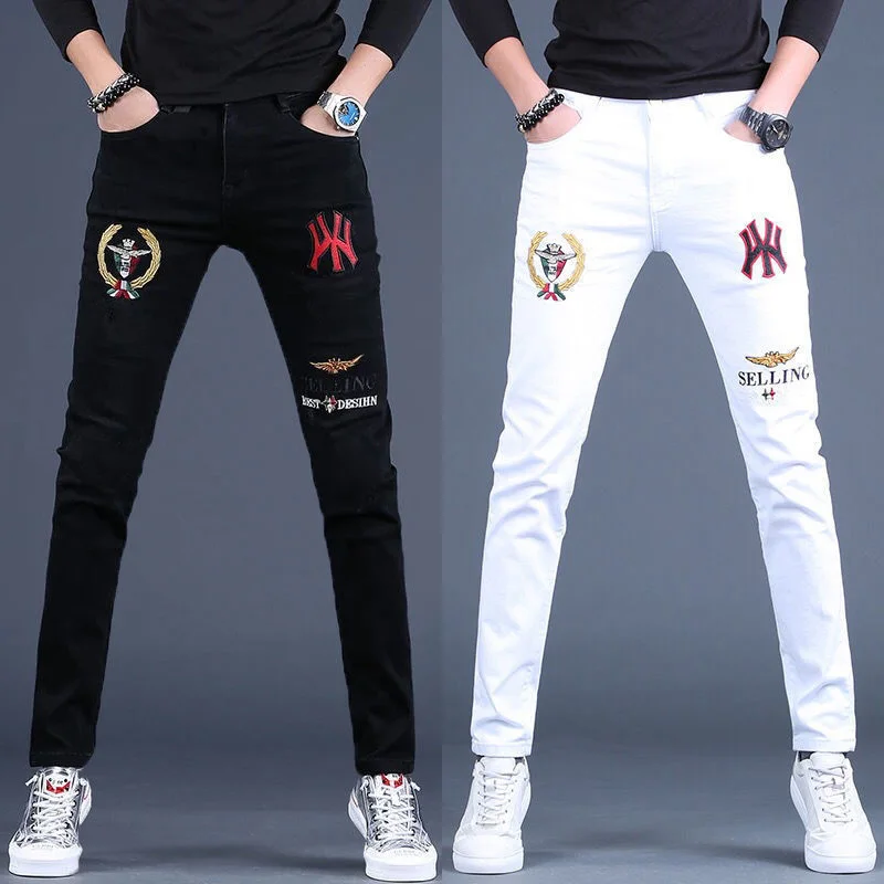 Mens embroidery slimming white jeans stretch denim pants Korea version trendy black jeans pants for men.