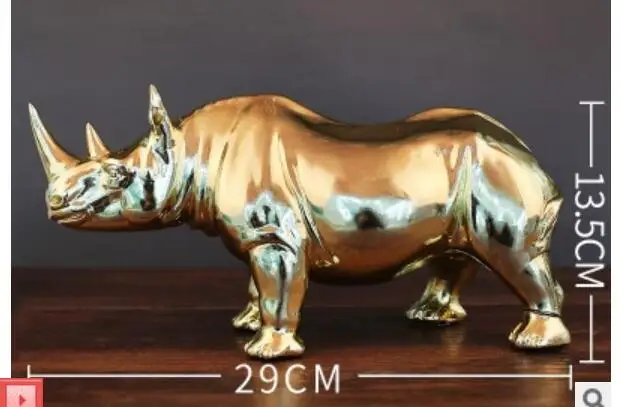 Aureate rhinoceros puts on electroplating handicraft decorate creative sitting room to act role of article office desktop