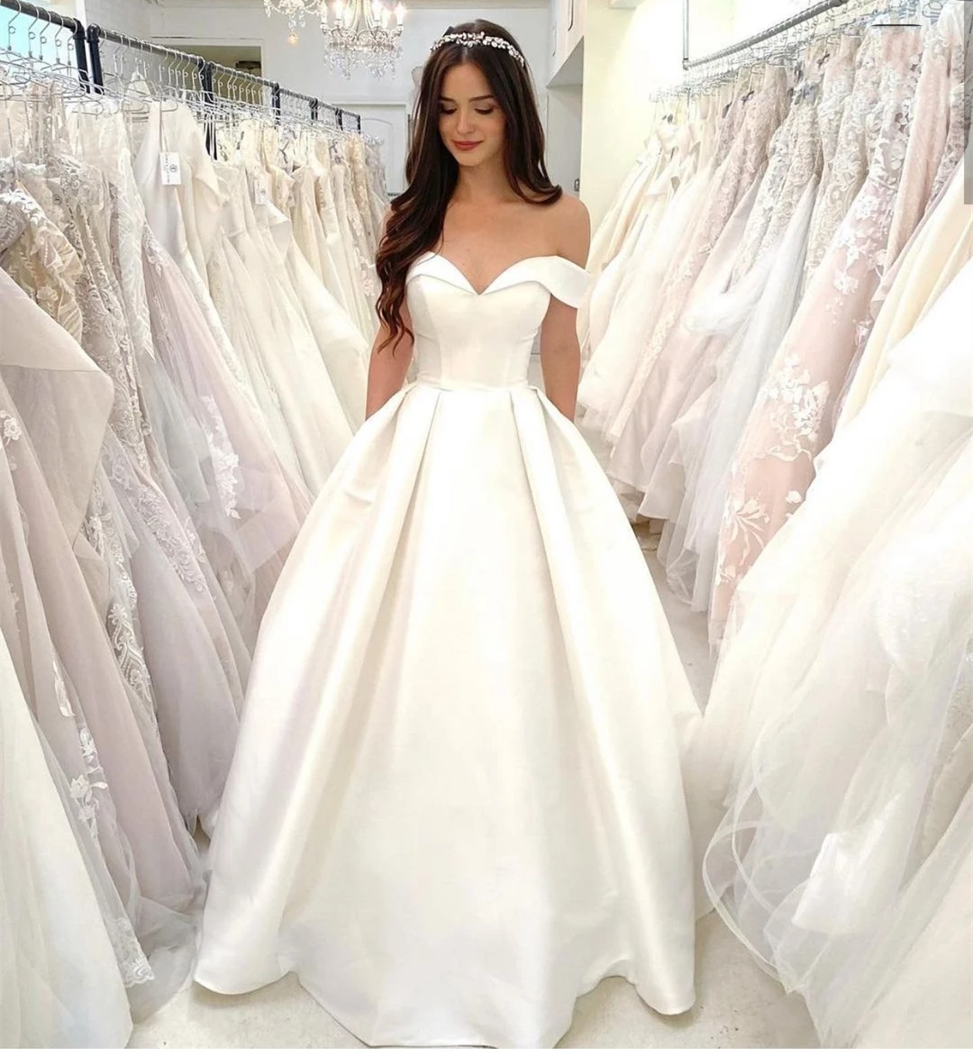 Vestido de novia largo hasta el suelo para mujer, prenda de satén con hombros descubiertos y bolsillo, brillante, de alta calidad, para playa