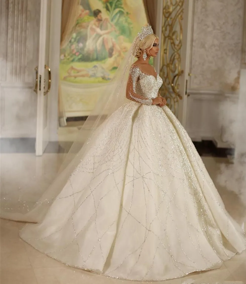 Lusso nuovo arrivo Dubai cristalli principessa abito da sposa bianco 2023 maniche Illusion perline gonfie abito da sposa corte treno