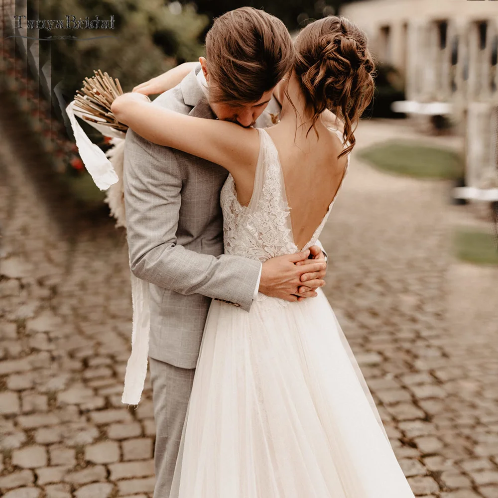 ลึกVคอชุดแต่งงานกระโปรงTulleลูกไม้Appliques Bohemianชุดเจ้าสาวBackless Beach Vestido De Noivas DW438