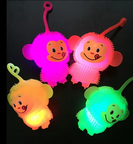 The New Colorful Glowing Maomao Monkey Vent Decompression Wu Empty Flash Ball Soft Rubber Call Ball Toys For Children 2021