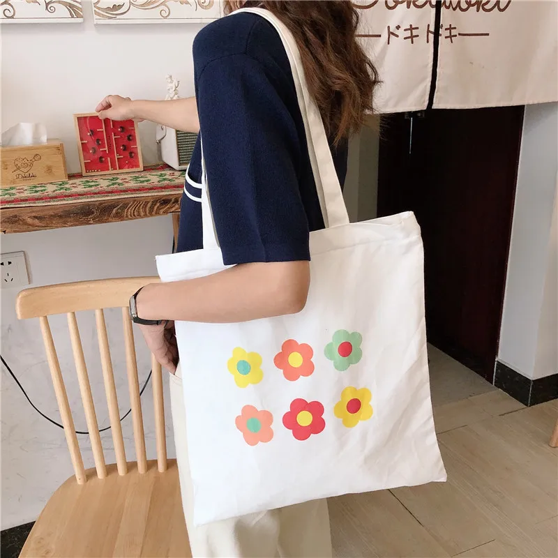 

White flower canvas bag female Japanese ins student shoulder bag portable canvas bag wholesale reusable shopping bag