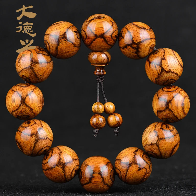 

Senior authentic solitary Hainan Huanghua pear hand string eye to ghost face sea yellow Dalbergia yellow sandalwood Buddha beads