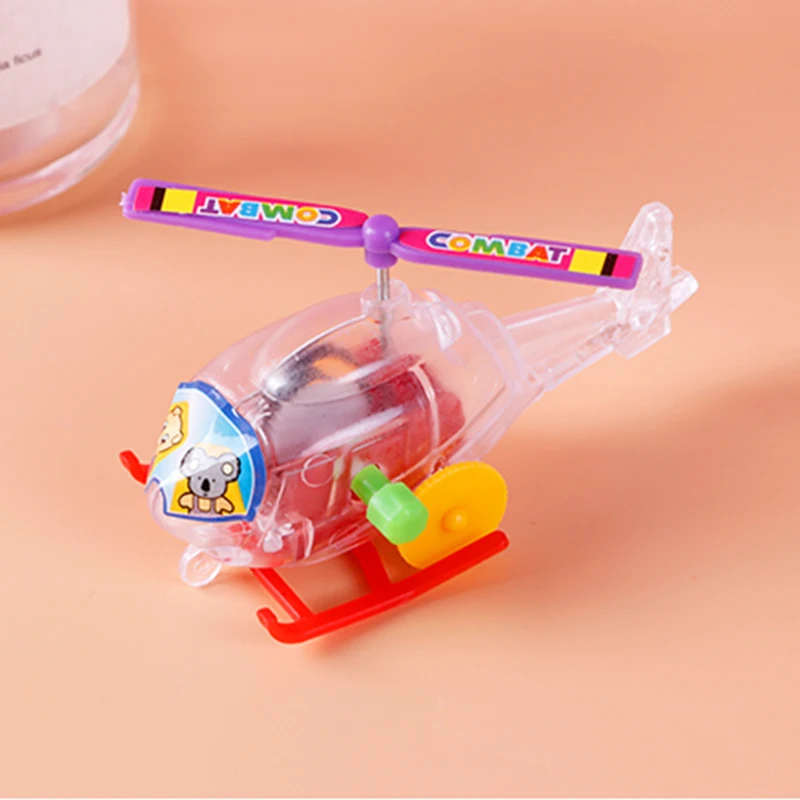 New and interesting wind-up clockwork toy transparent mini airplane helicopter pull-back toy child infant crawling toy