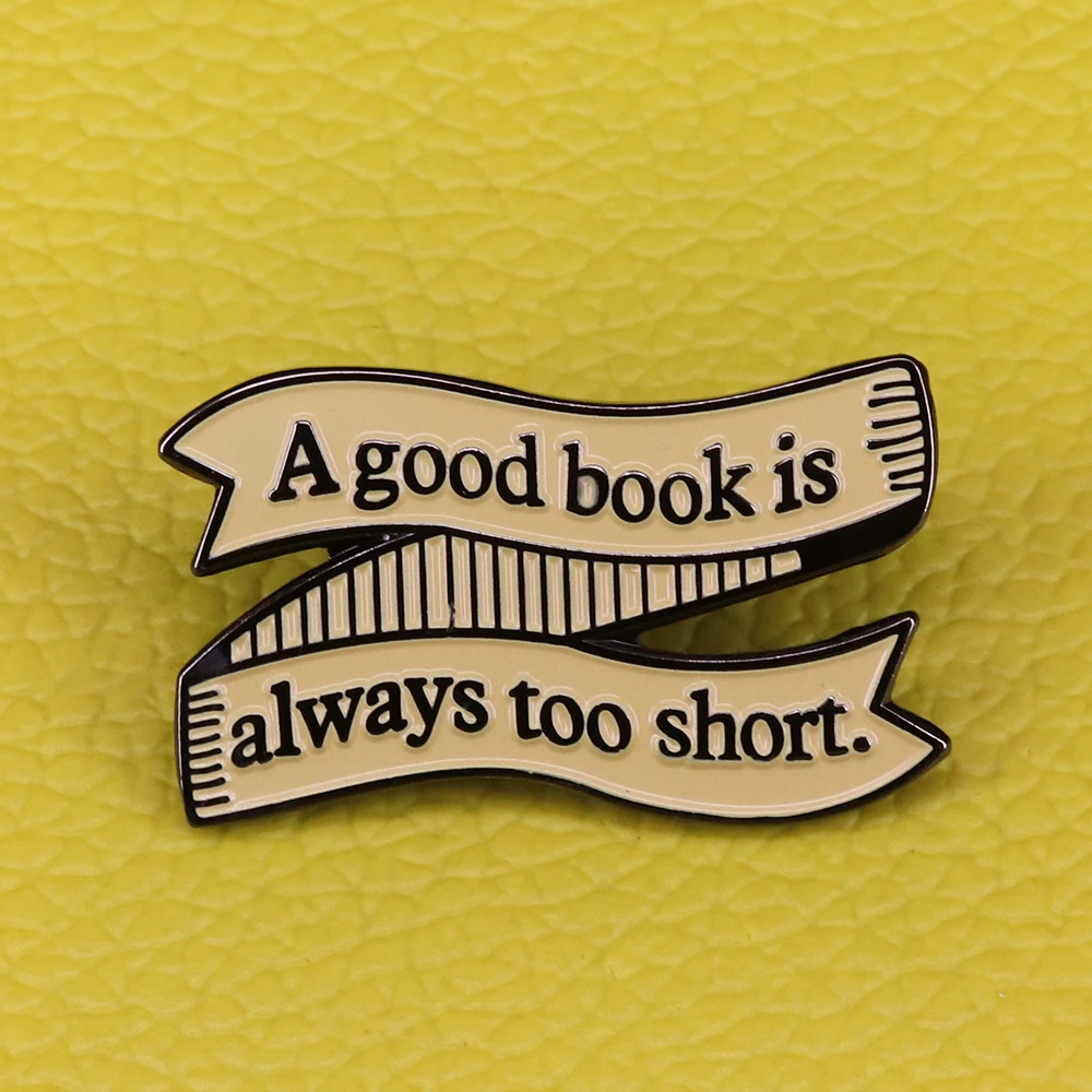 This literary enamel pin is a must for book lovers. It features a scrolling banner with the Jane Austen inspired quote