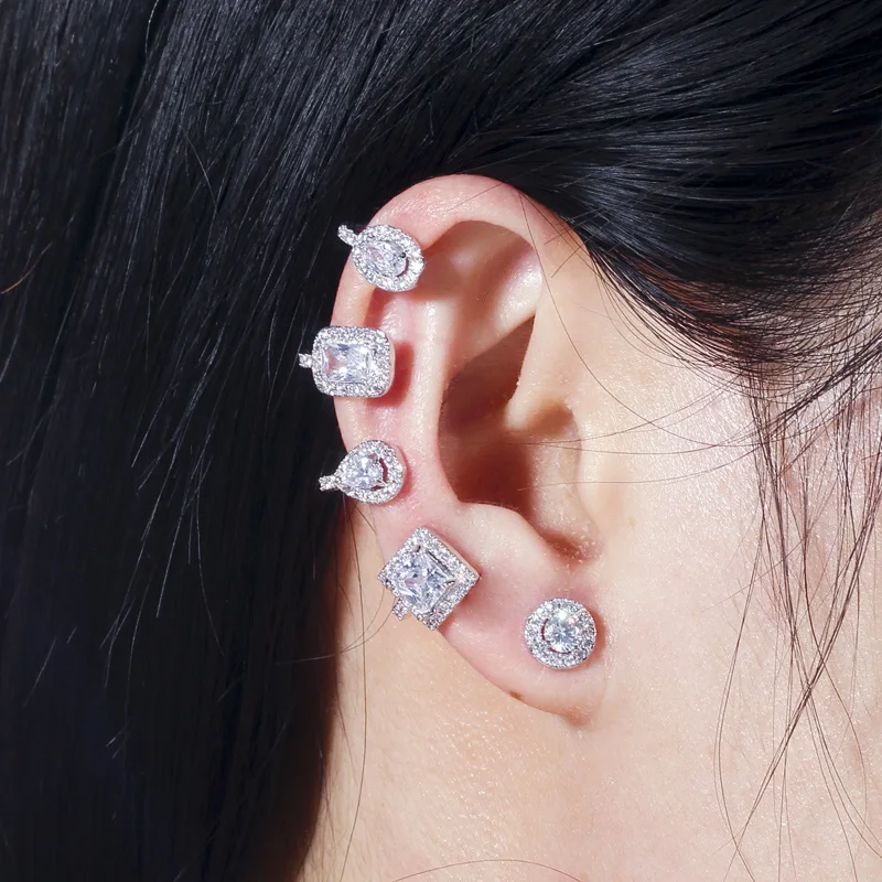 QooLady, pendientes de tuerca de cristal de circonia cúbica geométrica blanca brillante con puños para las orejas a la moda para mujer, joyería de estrella E180