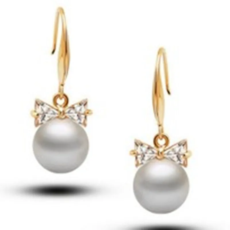 Korean fashion sweet and lovely crystal simulation pearl bow pendant female earrings wholesale