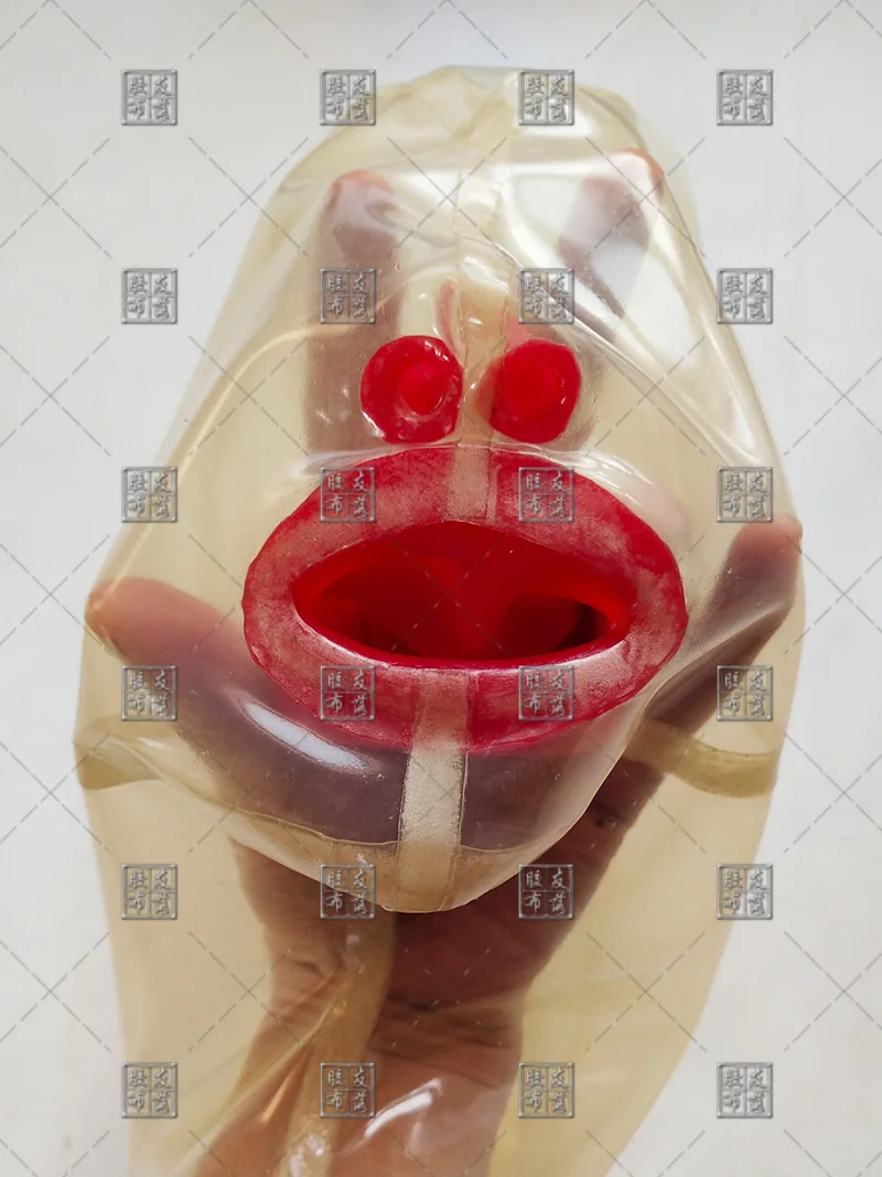 

TRANSPARENT LATEX MASK WITH RED TEETH AND NOSE TUBE CLOSE EYES