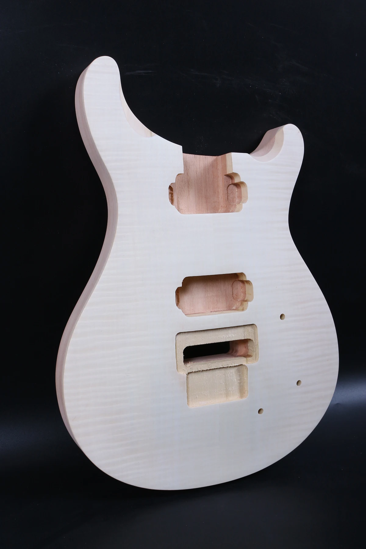 one unfinished electric guitar body