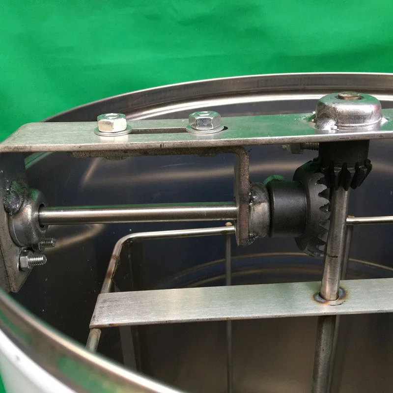 إطار مستخرج العسل اليدوي 2025 من الفولاذ المقاوم للصدأ معدات تربية النحل على شكل قرص العسل.