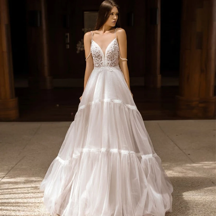 

Crystals Two Spaghetti Straps Empire Waist Nude Tulle Ball Gowns Wedding Dresses Sequin Bling Bling Bridal Gown