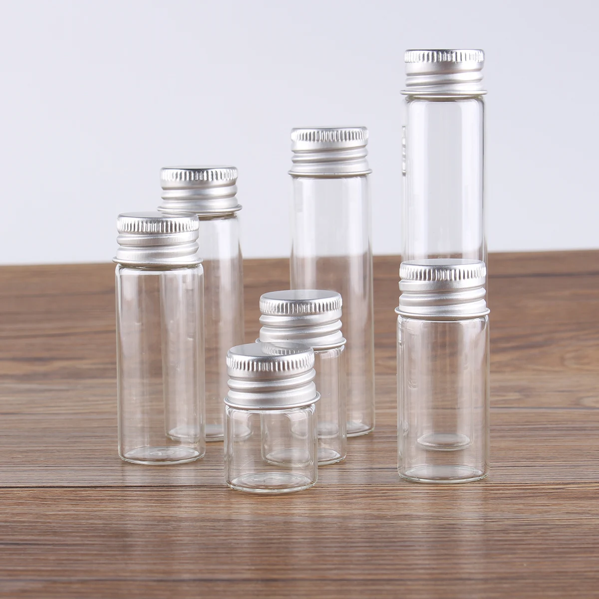 24 pieces/lot 5ml 7ml 10ml 14ml 18ml 20ml 25ml 30ml Glass Bottles with Aluminum Caps Empty Perfume Candy Jars for Art DIY Crafts