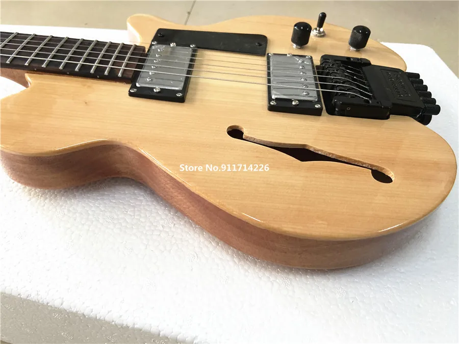 High-quality custom version of F hole headless electric guitar spruce panel double roll can be customized free shipping