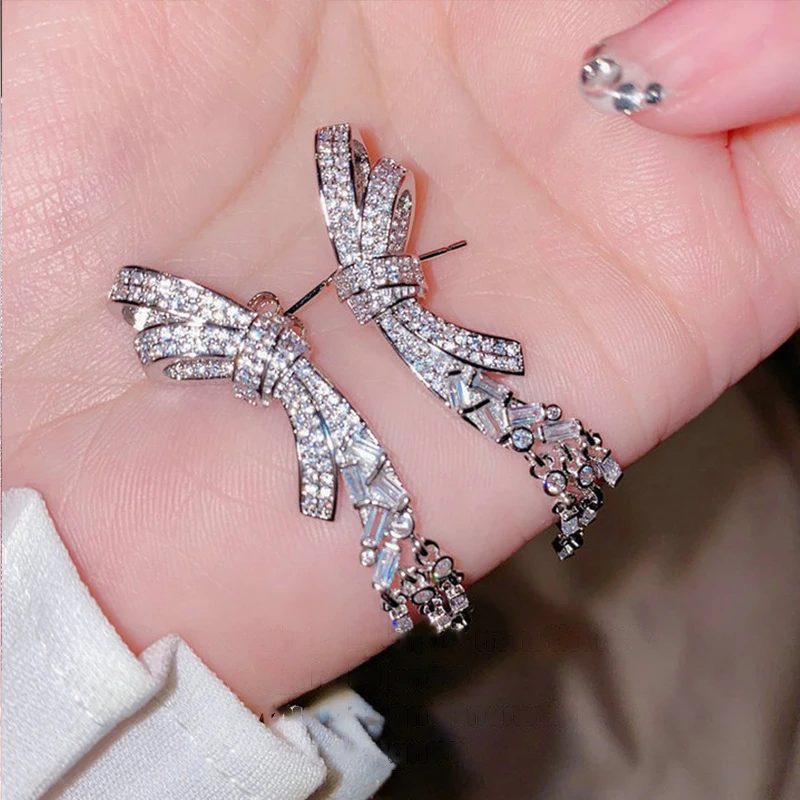 

Luxury Female Silver Color Earrings Sweet Bowknot Tassel Drop Pendant Zircon Earing Jewelry Anniversary Gifts