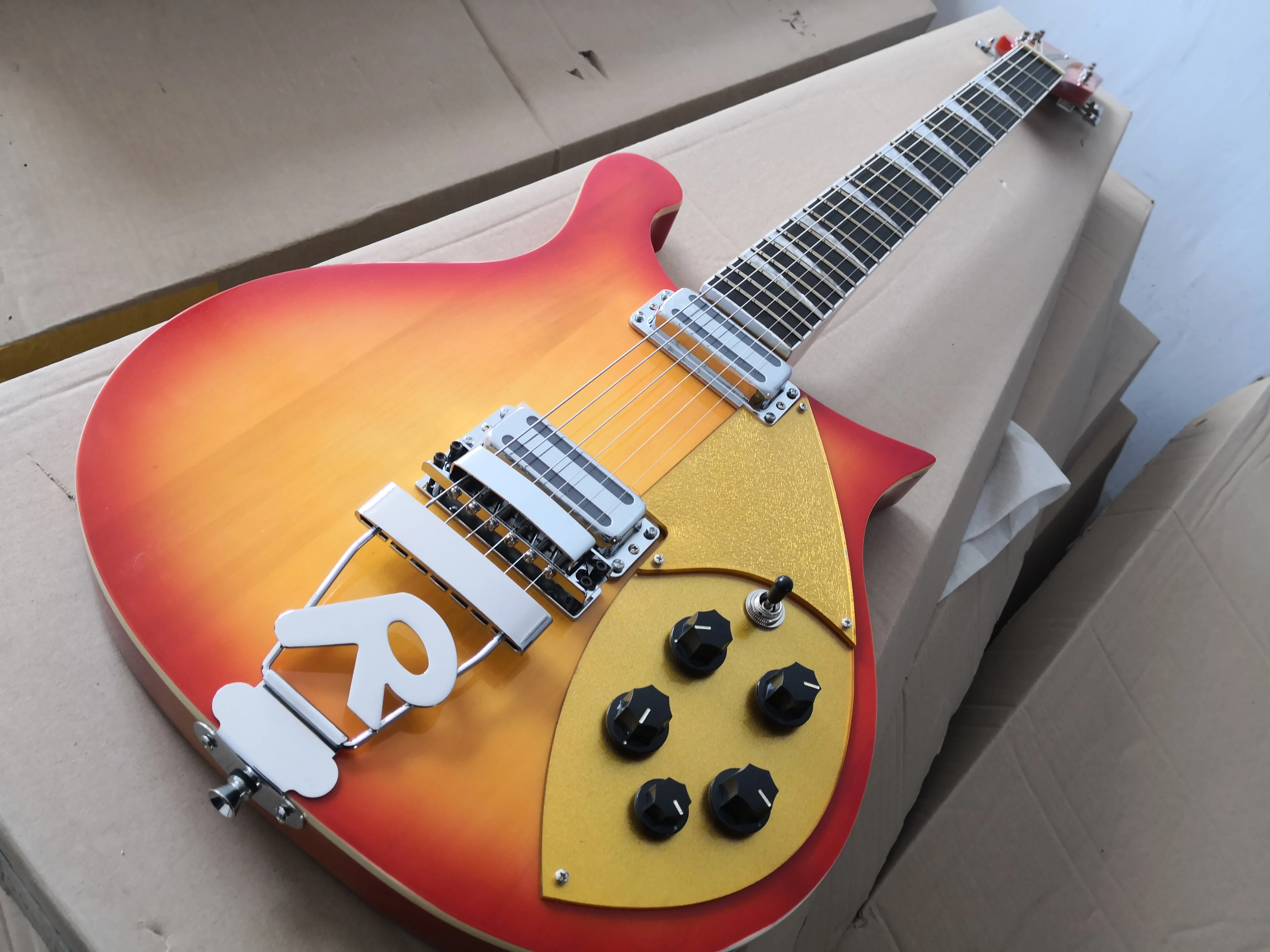 

custom 360 6 string guitar,tremolo bridge ,cherry sunburst body,5 switch ,chrome hardware,golden pickguard