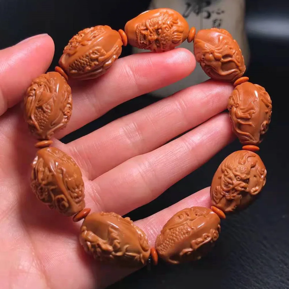 

Olive pit carving Kowloon Guan Gong bracelet double-sided carving one side Kowloon and one side Guan Gong bracelet Wenwan