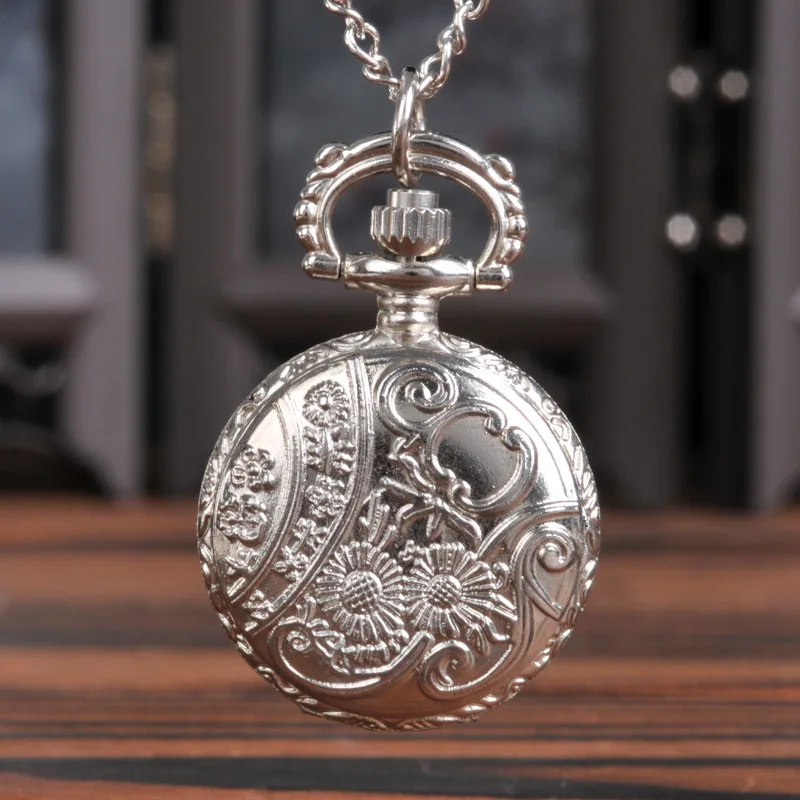 Small silver four-petal hollow quartz pocket watch