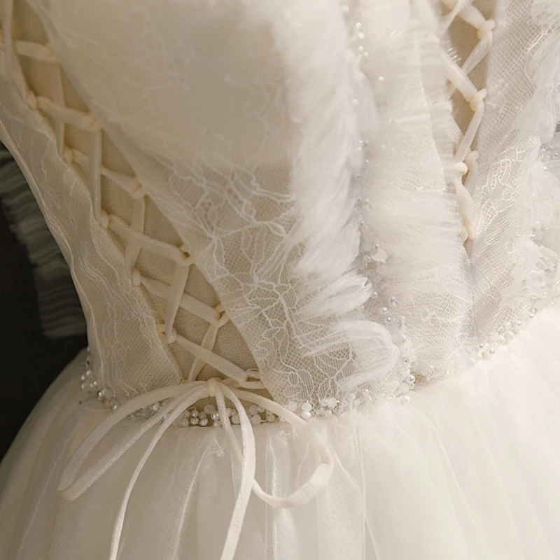 AnXin SH princesa encaje blanco correa de espagueti volantes lazo de cristal con cordones vestido de noche corto personalizado pequeño vestido blanco