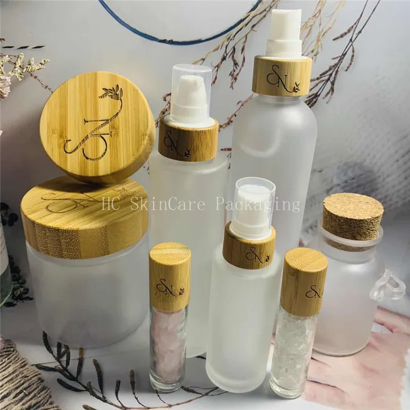 

Custom Logo frosted /white/clear plastic bottles and cream jars bamboo cap spray lotion pump bottle travel cosmetic bottles