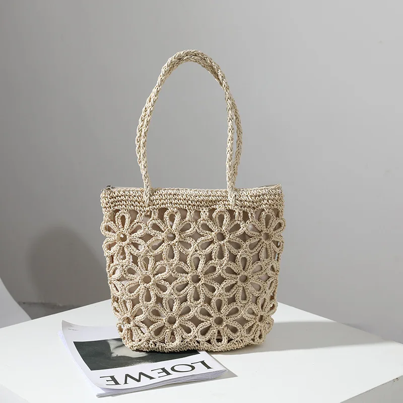 2024 nuova borsa di paglia borsa di paglia a fiore cavo borsa tessuta borsa a tracolla da donna portatile borsa in rattan da spiaggia per vacanze al mare