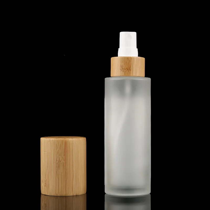 Wholesale Frosted Glass Bottles for Cosmetics Bottles with Bamboo Lid Covered  spray bottle mist